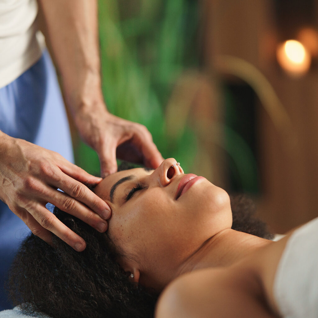 Woman receiving a relaxing massage therapy session.