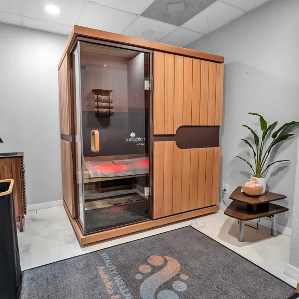 An infrared sauna in a modern spa room, offering advanced spa services.